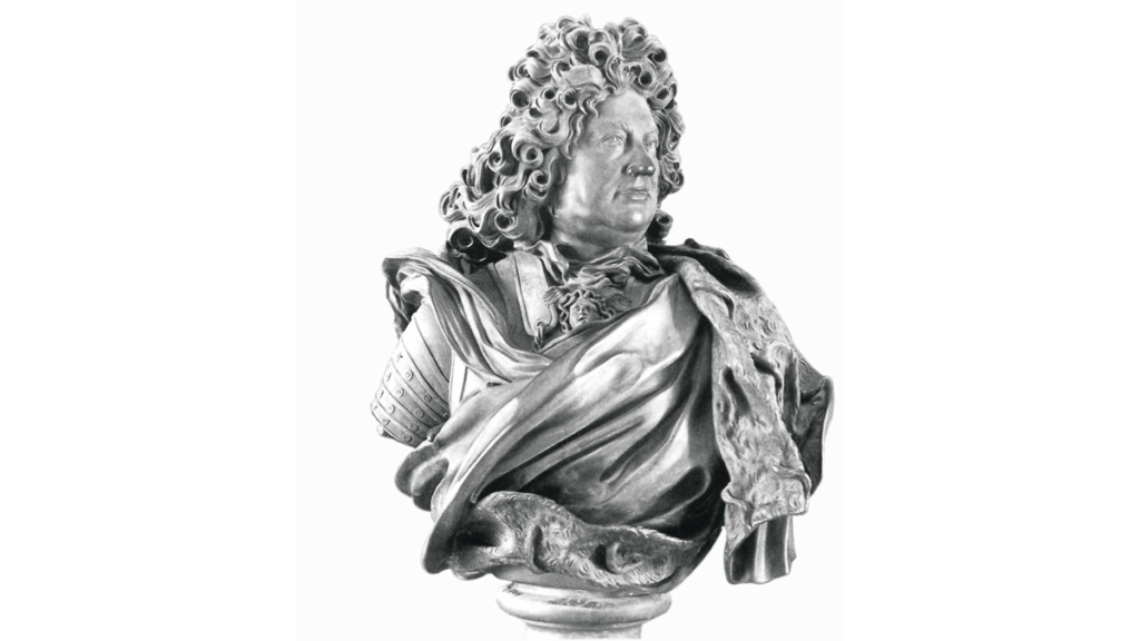 Die Büste von Friedrich II. Er trägt eine Lockenperücke und eine Schärpe