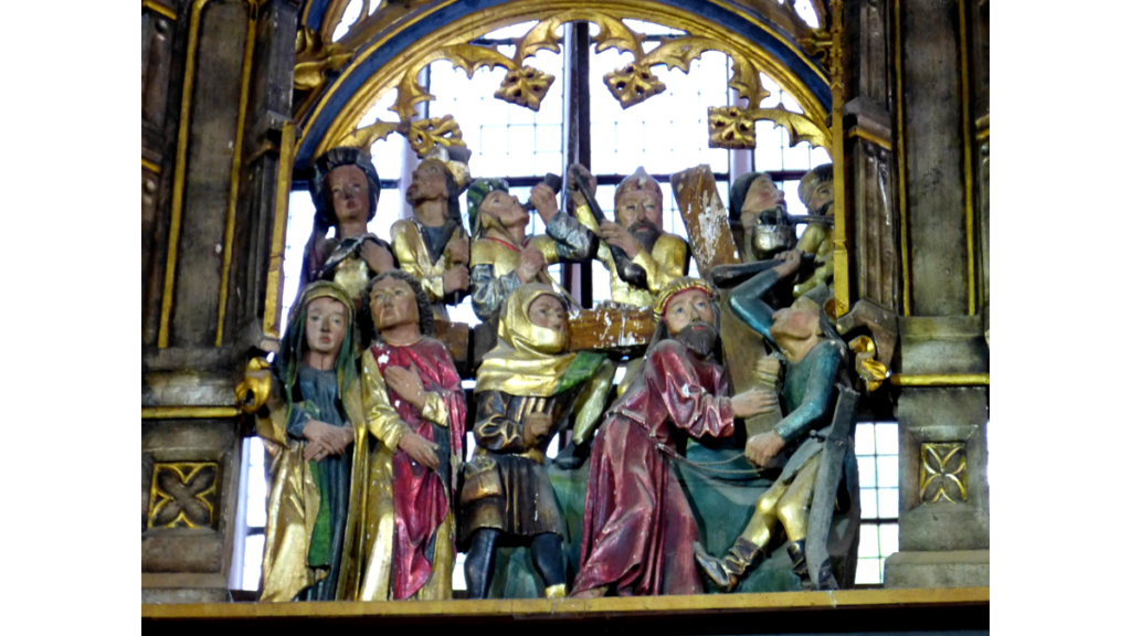 Ein Rlief aus dem Zieraufsatz über dem Hochaltar zeigt die Kreuztragung Christi