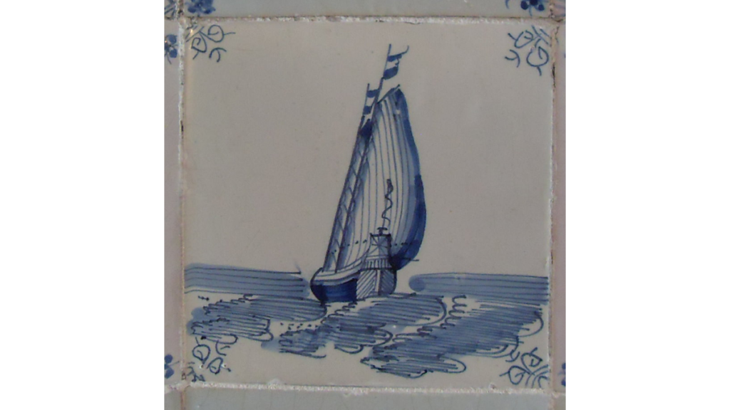 Eine einzelne Fliese im Delfter Blau mit einer Schiffsabbildung